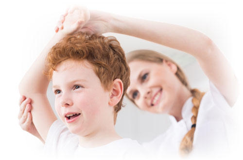 Physiotherapist streching kid's arm