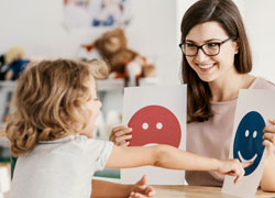 Speech Therapist teaching a kid